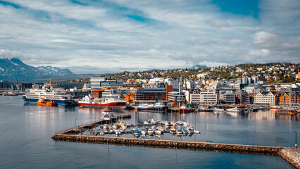 Fototapeta premium Cityscape of Tromso, Norway. Famous tourist destination in summer season for seeing midnight sun and for northern lights during winter time.