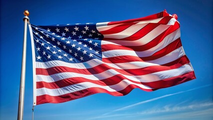 Fototapeta premium Patriotic American flag waving freely in the gusty wind against a clear blue sky, providing a proud and iconic symbol of freedom and independence on a white background.