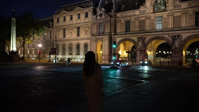 Paris, France, girl walking across bridge to Louvre