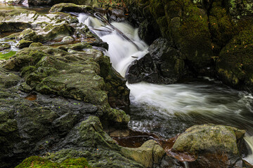 Long exposure of River Devon flowing down a waterfall in the Rumbling Bridge Gorge