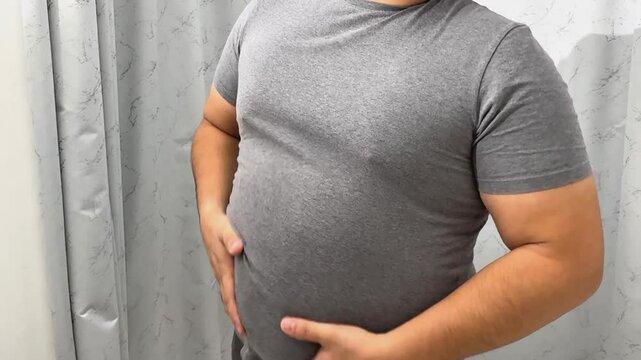 Man fat belly, The fat on the stomach of fat man over weight as for healthy concept. High quality 4k footage. High quality 4k footage