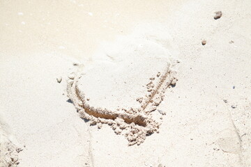 Heart in the sand on the beach. The concept of love.