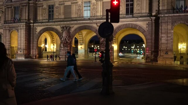 Paris, France, girl walking across bridge to Louvre