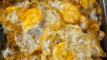 Fried eggs in trays for sale
