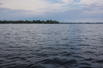 Fluffy Clouds in a Bright Blue Sky: Peaceful and Calm