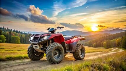Red atv quad bike parked on a mountain trail at sunset