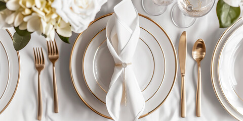 Elegant table setting is showing refined luxury with white and gold tones