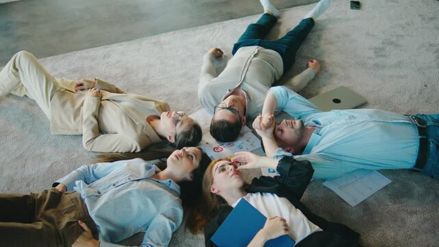 After work, colleagues come together on the office floor for a break, fostering unity and team spirit. This informal connection boosts the company camaraderie and collaboration
