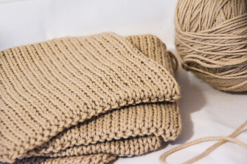 Beige yarn ball and knit squares collection