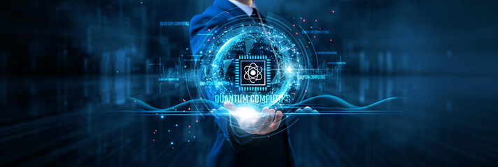 Quantum computing: Businessman holds quantum chip on global structure network and unprecedented...