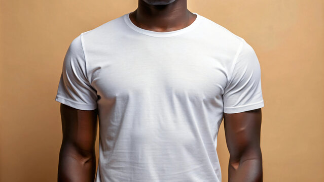 A casually handsome black man in a white mockup t-shirt  in a cool studio portrait