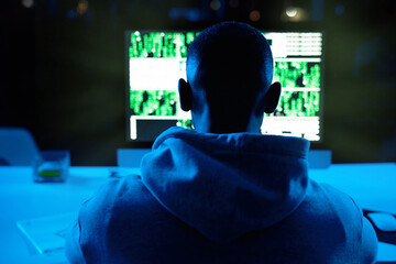 Back, person or hacker with laptop for cybercrime, malware or phishing for stealing online data....