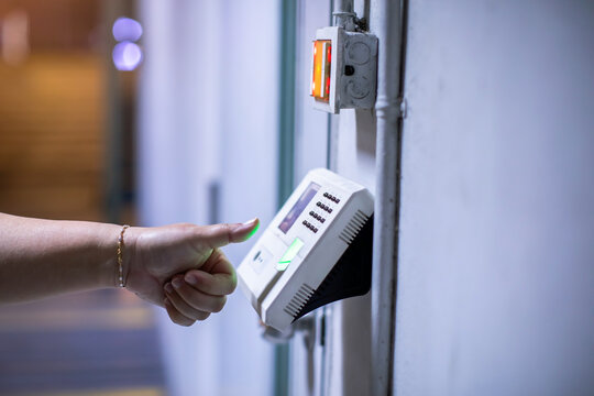 Staff push down electronic control machine with finger scan to access the door of control room or data center. The concept of data security or data access control.