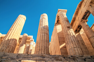 Looking up at a columns of Propylaea gateway in Acropolis of Athens, Greece.