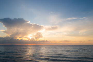 Cloudy sky on sea sunset, sunrise on ocean beach. Sunset landscape in the sky after sunset. Sunrise with clouds of different colors against the sky and sea.