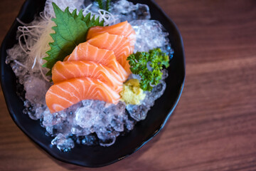Salmon sashimi with wasabi over ice by top view in Japan restaurant