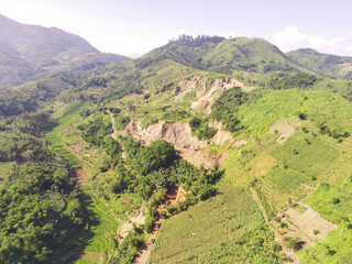Bird eye view of Broken Mountain decorated with forest. Mining Industry. Panoramic Landscape. Graphic Resources. Selective Focus. Aerial Landscape Photography Concept