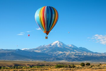 Fototapeta premium A_colorful_hot_air_balloon_floating_in_a_clear_blue