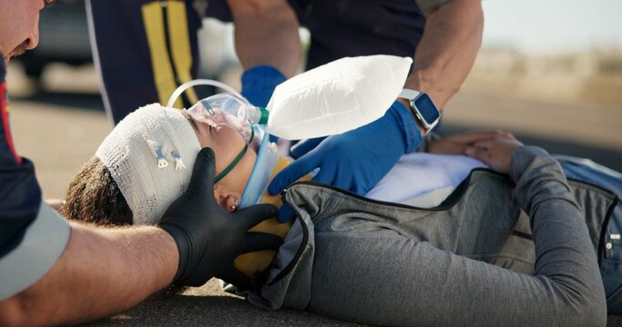 Paramedic, emergency and injury check on road from car crash accident with healthcare, EMT men and first aid. Patient support, ambulance staff and medical exam for concussion with rescue on stretcher
