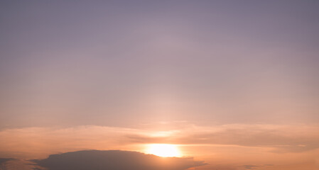 Fototapeta premium Panoramic view of sunset golden and blue sky nature background. Colorful dramatic sky with cloud at sunset.Sky background.Sky with clouds at sunset.