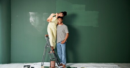 Couple, people and happy with painting wall for house renovations, upgrade and bonding. New home,...