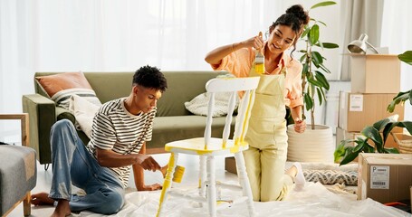 New home, painting and couple in lounge, chair and teamwork with crafts, furniture and cooperation....