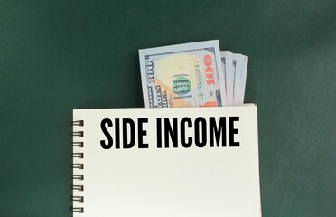 books and paper money with the word side income. the concept of finding income