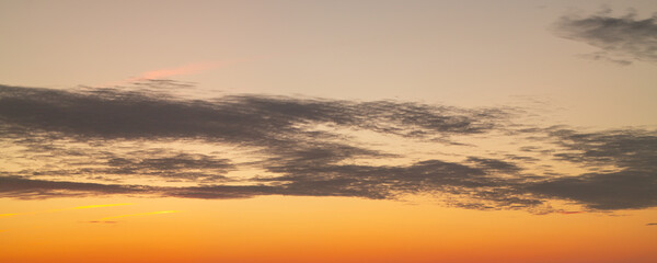 Sunset clouds are gathering. Panoramic sunrise or sunset sky with clouds. Sunset Sky on Twilight in the Evening with Sunset. Cloud Nature Sky Backgrounds. Sky Sunrise, Dusk clouds.