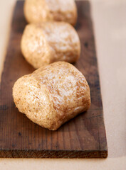 Fototapeta premium Homemade wholemeal steam buns on brown background