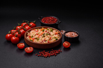 Delicious boiled rice with vegetables carrots, peas and peppers