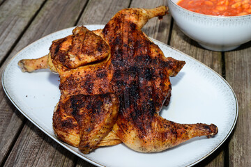 Pollo alla Diavola Spatchcocked Italian Grilled Hot Chicken Seasoned with Peperoncino Chili and Served with Fagiole all Uccelletto Beans