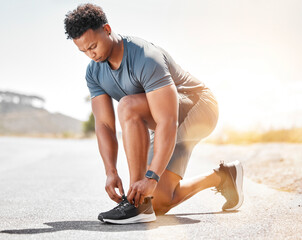 Fitness, man and tie shoes in road for cardio exercise, running or marathon training. Sports, feet...
