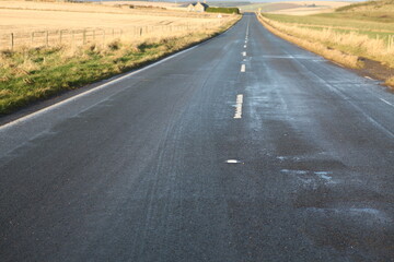 White painted roadmark on a countryside road - Stonehaven - Aberdeenshire - Scotland - UK