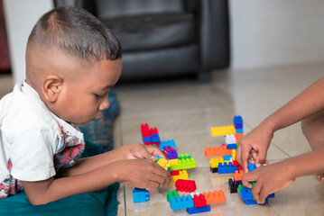 A boy is playing a disassembling game at home