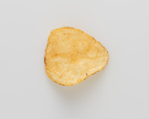 Organic potato chip from above on white