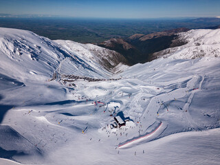 Mt Hutt, New Zealand: Aerial view of Mt Hutt ski resort slopes and chair lift in the Canterbury region on a winter sunny day in New Zealand south island near Chistrchurch