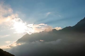 Endless Horizons: Golden Sunset Over Mountain Range