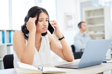 Woman, cellphone and sad in office for phone call conversation, upset and bad news at desk. Laptop, stress and headache for online communication, anxiety or sales person for loss on commission