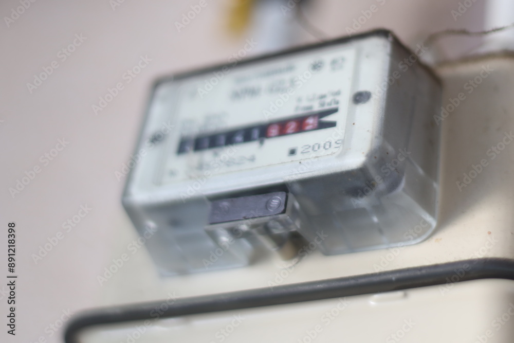 Aufkleber close-up view of a meter on a wall.
