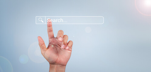 Human hand touching search bar for Search Engine Optimization or SEO to search information or information by internet connection, internet, network, database,information system.