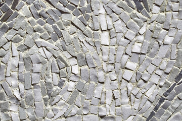 Monochrome texture or background made of small ceramic tiles