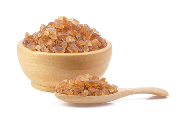 Brown rock sugars close up on white background.