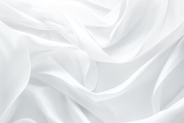 Obraz premium A close-up of white fabric draped in soft folds, creating a delicate and ethereal texture. Background backdrop
