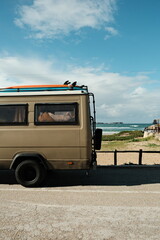 Vertical Image of Camping of Retro Surf Van on the Beach.