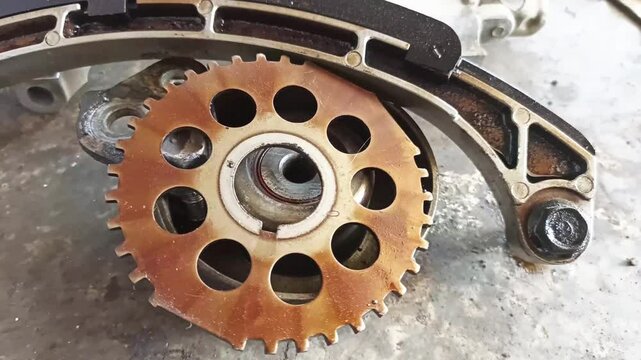 Car timing set chain gear. Part of a car engine being repaired