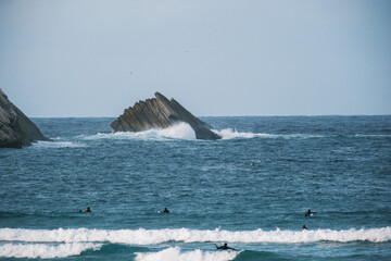 Group of Surfers on the Water at Atlantic Ocean of Portugal Coastline. 