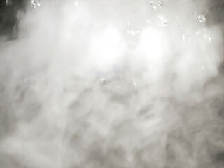 An Abstract Image of white steam with water droplets as background.