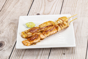 Grilled salmon skewer with sauce
