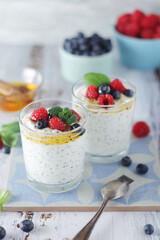 Greek yogurt in glasses with berries and quinoa	