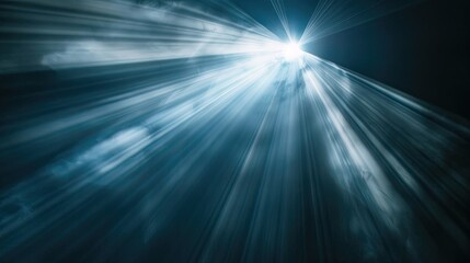 Radiant light beam piercing through darkness, close-up on black